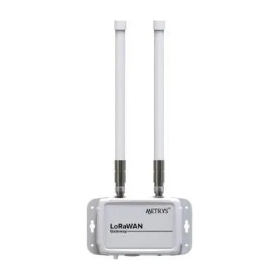 A Metrys LoRaWAN gateway in a white weatherproof case with two external whip antennas.
