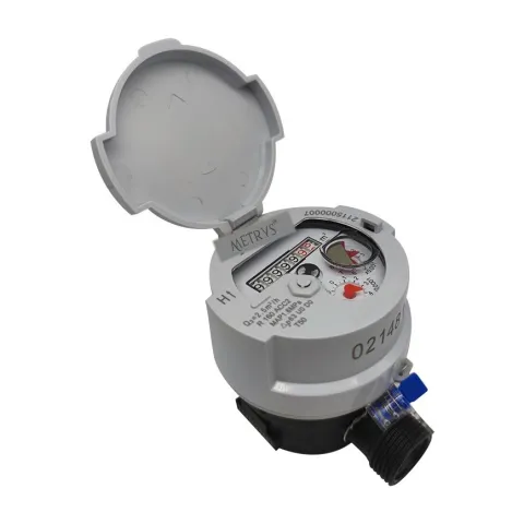 A Metrys single-jet water meter with a copper-and-glass register in a grey housing, lid open.