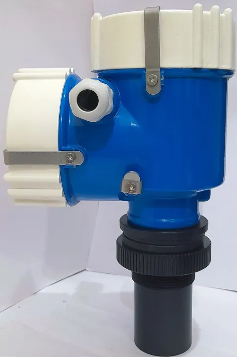 A Metrys open channel ultrasonic flow meter in one piece: a blue housing with white screw caps above a black ultrasonic sensor.