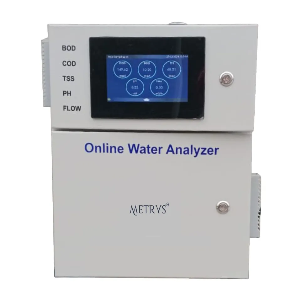 A Metrys online water analyser in a light grey two-door cabinet, its touch screen showing COD, BOD, TSS, pH and flow readings.