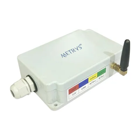 A Metrys GPRS telemetry modem in a light grey enclosure with a cable gland, a stub antenna on a brass connector, and a colour-coded wiring label for 12V, GND, A(TX+) and B(TX-).